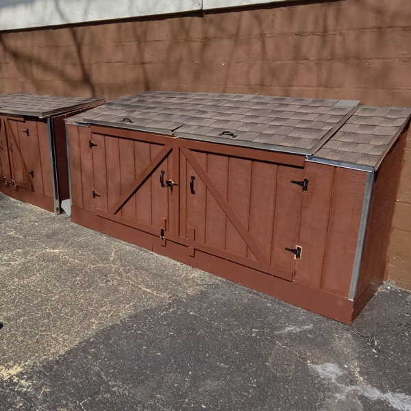 Two wooden storage boxes on the ground, providing a practical and stylish solution for organizing belongings.